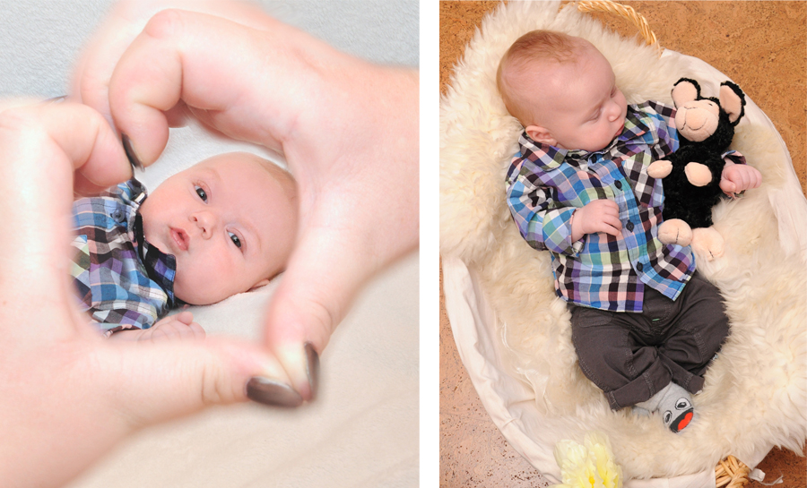 Herz mit den Händen und Baby schlafend im Korb
