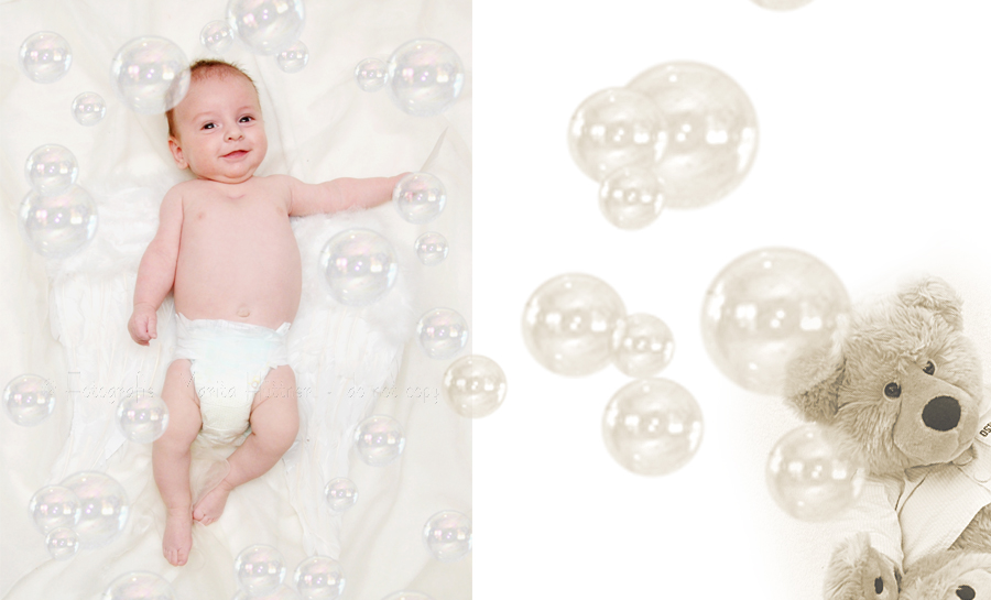 Baby mit Engelsflügeln und Seifenblasen